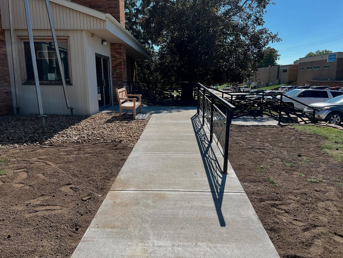 Professional concrete walkway with railings